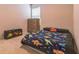 bedroom with dinosaur themed decorations and furniture, including a dinosaur blanket and toy box at 547 Sardinia Cir, Davenport, FL 33837