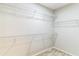 A walk-in closet equipped with multiple white, sturdy, wire shelving units for optimal storage capacity at 547 Sardinia Cir, Davenport, FL 33837