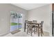 The dining area features a wood table and chairs with a sliding glass door leading to the backyard at 547 Sardinia Cir, Davenport, FL 33837