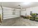 Spacious garage with overhead door and opener, with ample room for parking and storage solutions at 547 Sardinia Cir, Davenport, FL 33837