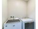Dedicated laundry room with modern Maytag washer and dryer, offering convenience and efficiency at 547 Sardinia Cir, Davenport, FL 33837