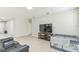 Bright living room with neutral paint and tile floors, ready for personalization at 547 Sardinia Cir, Davenport, FL 33837
