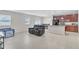 Open-concept living space with tile flooring, connecting living room to kitchen and dining area at 547 Sardinia Cir, Davenport, FL 33837