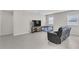 Comfortable living room showcasing neutral walls, tile flooring, and bright, natural light at 547 Sardinia Cir, Davenport, FL 33837