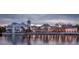 Picturesque aerial view of the community reflecting sunset colors on lake at 539 Water St # 539, Kissimmee, FL 34747