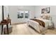 Cozy bedroom with bright windows, light wood floors, and neutral decor at 539 Water St # 539, Kissimmee, FL 34747