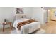 Comfortable bedroom with soft bedding, wood-look floors, and an en-suite bathroom at 539 Water St # 539, Kissimmee, FL 34747