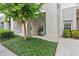 Charming condo exterior featuring lush landscaping, a covered entry, and a well-maintained facade at 539 Water St # 539, Kissimmee, FL 34747