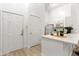 Bright kitchen with quartz counters, stainless appliances, and breakfast bar seating at 539 Water St # 539, Kissimmee, FL 34747
