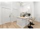 Bright kitchen with quartz counters, stainless appliances, and breakfast bar seating at 539 Water St # 539, Kissimmee, FL 34747