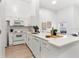 Bright kitchen featuring white cabinets, quartz counters and modern appliances at 539 Water St # 539, Kissimmee, FL 34747