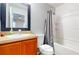 Standard bathroom with a vanity, toilet, shower, and tub combo at 5494 Paradise Cay Cir, Kissimmee, FL 34746