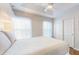 Neutral bedroom with recessed lights, ceiling fan, closet, and large windows at 5494 Paradise Cay Cir, Kissimmee, FL 34746