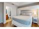 Beautiful bedroom with private bath, wood floors, ceiling fan, and a built-in wardrobe at 5494 Paradise Cay Cir, Kissimmee, FL 34746