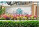 Welcome to Paradise Cay! Beautiful community entrance with colorful landscaping at 5494 Paradise Cay Cir, Kissimmee, FL 34746