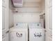A small closet turned laundry room with washer and dryer, plus built in shelves at 5494 Paradise Cay Cir, Kissimmee, FL 34746