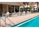 Relax at the community pool with outdoor seating and covered lounge area at 5494 Paradise Cay Cir, Kissimmee, FL 34746