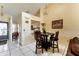 Cozy dining area with bar seating and chandelier, with easy access to kitchen and living spaces at 62 Lakepointe Cir, Kissimmee, FL 34743