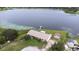 Stunning aerial view shows a home with an expansive yard, private dock and lake access at 124 Pangola Dr, Winter Haven, FL 33880