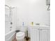 Small bathroom with white cabinets, sink, toilet, and shower and tub combination at 124 Pangola Dr, Winter Haven, FL 33880