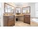 Bathroom featuring dual vanities, granite countertops, and tile flooring at 124 Pangola Dr, Winter Haven, FL 33880
