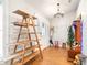 View of the entryway with wood floors, shelving, decor, and front door at 124 Pangola Dr, Winter Haven, FL 33880