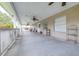 Spacious front porch features multiple ceiling fans, rocking chairs, and decor at 124 Pangola Dr, Winter Haven, FL 33880