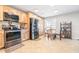 Bright eat-in kitchen featuring stainless appliances, light wood cabinets, and a view of the backyard at 124 Pangola Dr, Winter Haven, FL 33880
