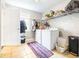 Bright laundry room with tile flooring, washer, dryer, storage, and a window at 124 Pangola Dr, Winter Haven, FL 33880