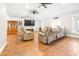 Living room with wood floors, recessed lighting, comfortable seating, and neutral paint at 124 Pangola Dr, Winter Haven, FL 33880