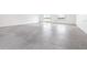 Spacious living space with a lake view provides tons of natural light and gorgeous flooring at 124 Pangola Dr, Winter Haven, FL 33880