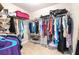 A well-organized walk-in closet with ample storage space, shelving, and hanging rods at 124 Pangola Dr, Winter Haven, FL 33880