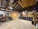Large garage with a workbench, tool storage, and a high ceiling at 4145 Willis Rd, Mulberry, FL 33860