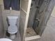 Small bathroom featuring tiled shower and toilet at 12828 Sw 49Th Ter, Webster, FL 33597