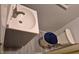 Compact bathroom with a pedestal sink, and toilet. The small space has updated linoleum flooring at 12828 Sw 49Th Ter, Webster, FL 33597