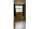 Modest bedroom with tile flooring and a window allowing natural light to filter in at 12828 Sw 49Th Ter, Webster, FL 33597