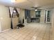 Bright living space with tile floors, desk and a ceiling fan at 12828 Sw 49Th Ter, Webster, FL 33597