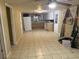 Open-concept living area featuring neutral-toned walls and tile flooring at 12828 Sw 49Th Ter, Webster, FL 33597