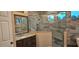 Stylish bathroom featuring a granite vanity, glass shower, and modern design at 19041 Mardi Gras St, Orlando, FL 32833