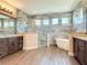 Luxurious bathroom boasting a modern shower, freestanding tub, tiled walls, and double vanity at 19041 Mardi Gras St, Orlando, FL 32833