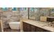 Elegant bathroom with a freestanding tub, granite countertops, and a glass-enclosed shower at 19041 Mardi Gras St, Orlando, FL 32833