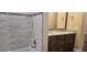 Bathroom with granite double vanity and tiled shower at 19041 Mardi Gras St, Orlando, FL 32833