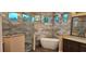 Luxurious bathroom featuring a soaking tub, glass shower, and modern fixtures at 19041 Mardi Gras St, Orlando, FL 32833
