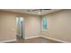 Cozy bedroom featuring wood-look flooring and natural light from a single window at 19041 Mardi Gras St, Orlando, FL 32833