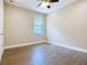 Bedroom featuring wood-look tile flooring, neutral paint, and natural light at 19041 Mardi Gras St, Orlando, FL 32833