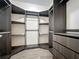 Well-organized walk-in closet with ample shelving and storage drawers at 19041 Mardi Gras St, Orlando, FL 32833