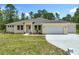 Charming single-story home with well-manicured lawn and attached two car garage at 19041 Mardi Gras St, Orlando, FL 32833