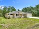 Well maintained single-story home features a well-manicured lawn and ample shade trees at 19041 Mardi Gras St, Orlando, FL 32833