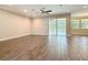 Living room features hard wood floors, recessed lights, ceiling fan and sliding glass doors at 19041 Mardi Gras St, Orlando, FL 32833