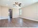 Open-concept living room with wood-look floors, recessed lighting, and a bright, airy feel at 19041 Mardi Gras St, Orlando, FL 32833